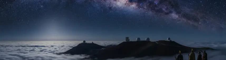 The old website’s star-filled sky above mountain observatories and clouds